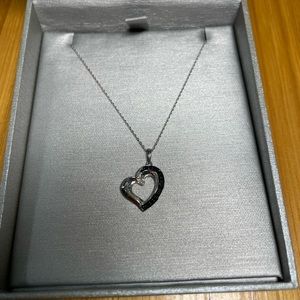 10kt white gold neckless with heart charm.